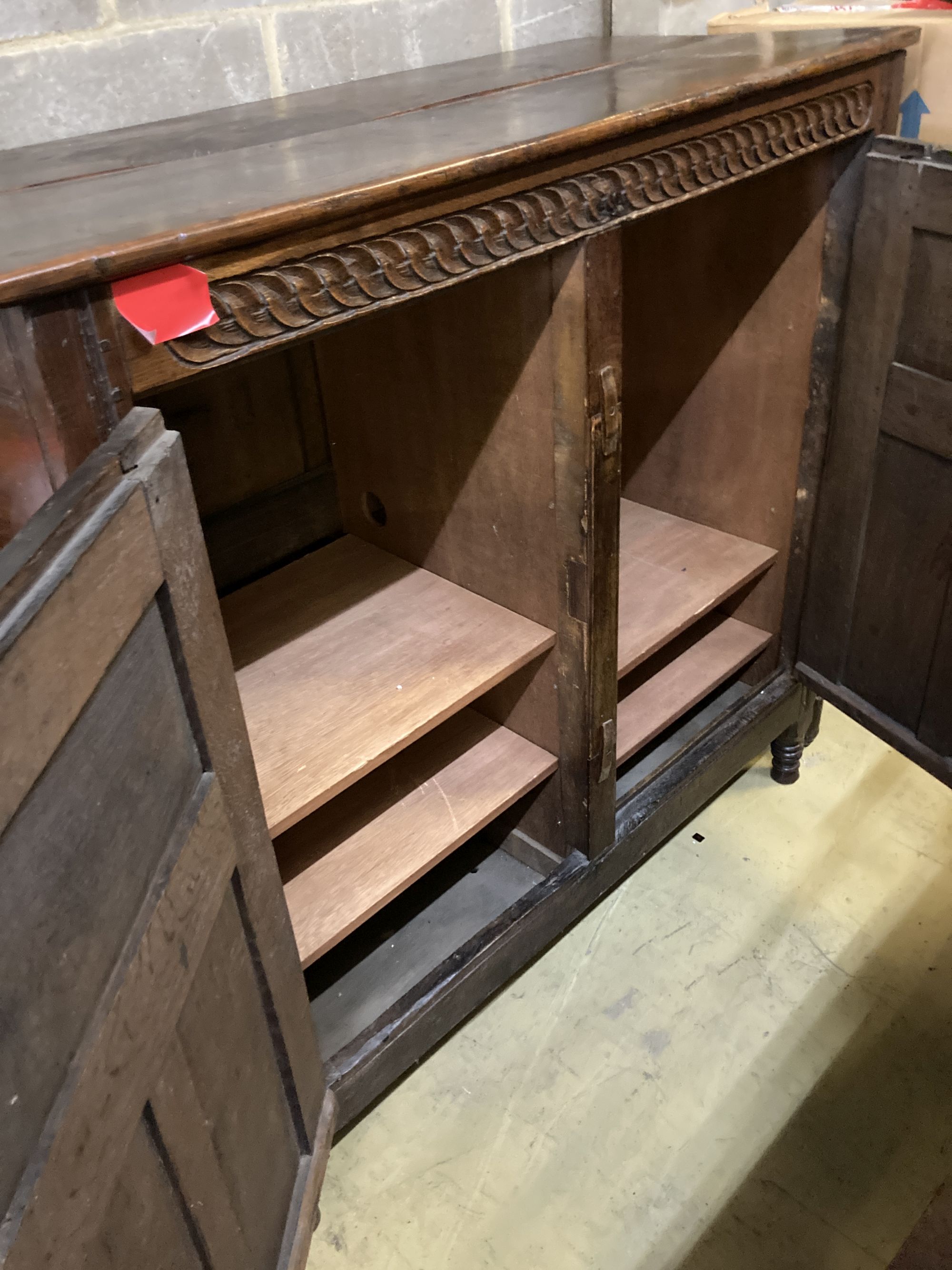 An 18th century panelled oak Livery cupboard (adapted), width 130cm, depth 57cm, height 128cm